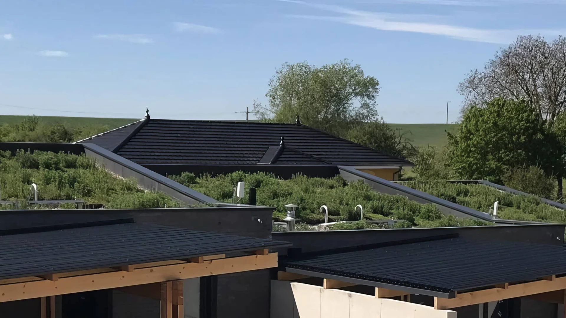 Solar panels on cabin roof in green dunes landscape