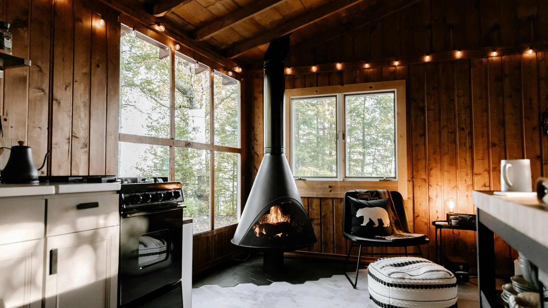 Sustainable cabin interior with natural light and wooden beams